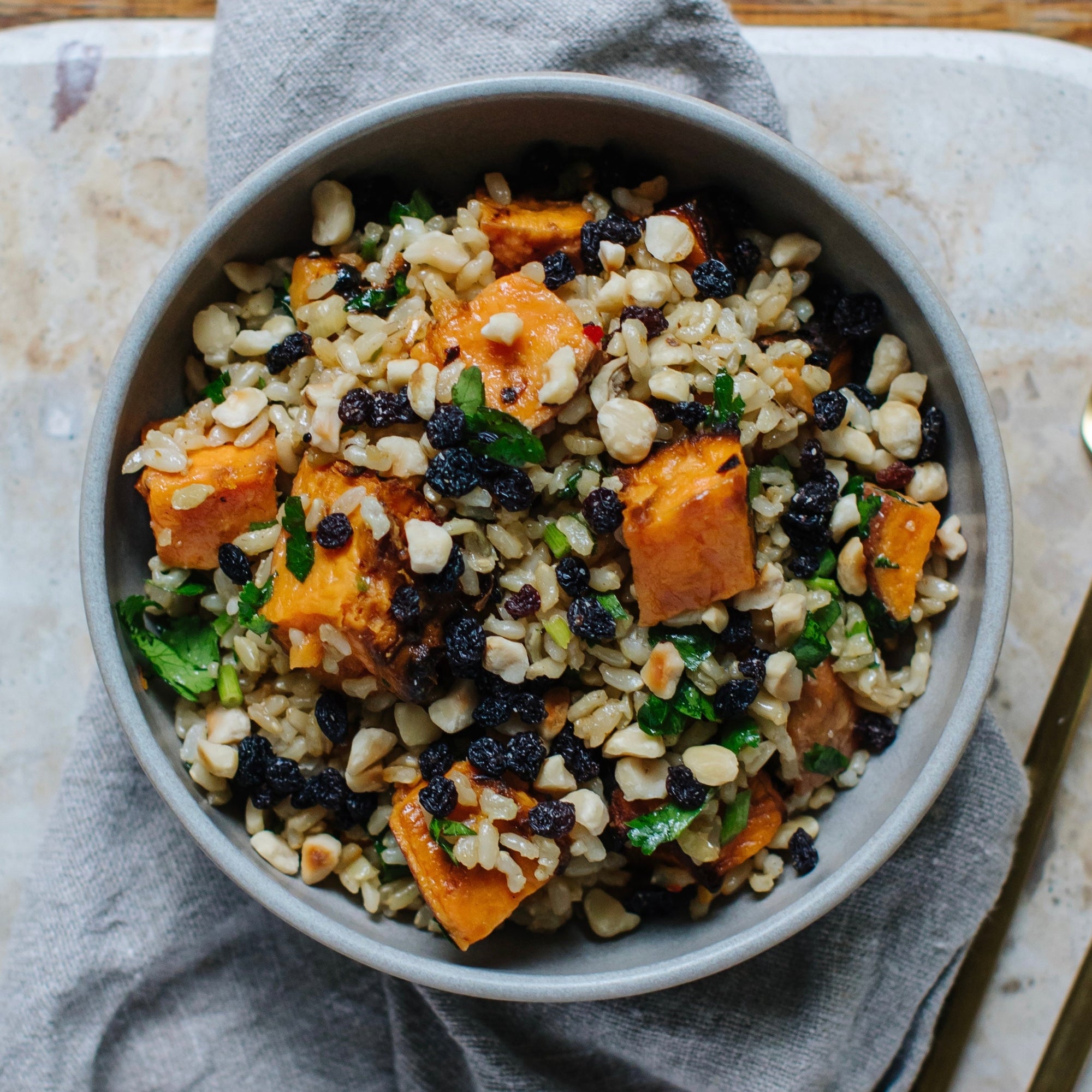 With brown rice, hazelnuts, currants and a chilli maple dressing.
